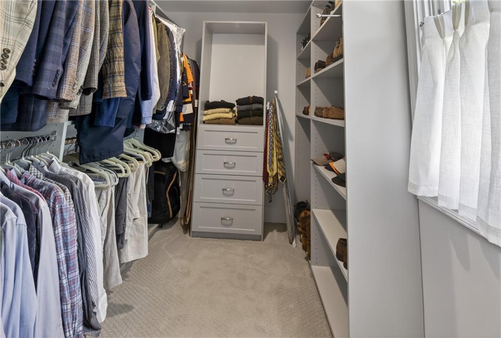 755 Greenview Avenue Northeast Atlanta, GA 30305 - Photo 16 of 28 a view of walk in closet with clothes and shoes