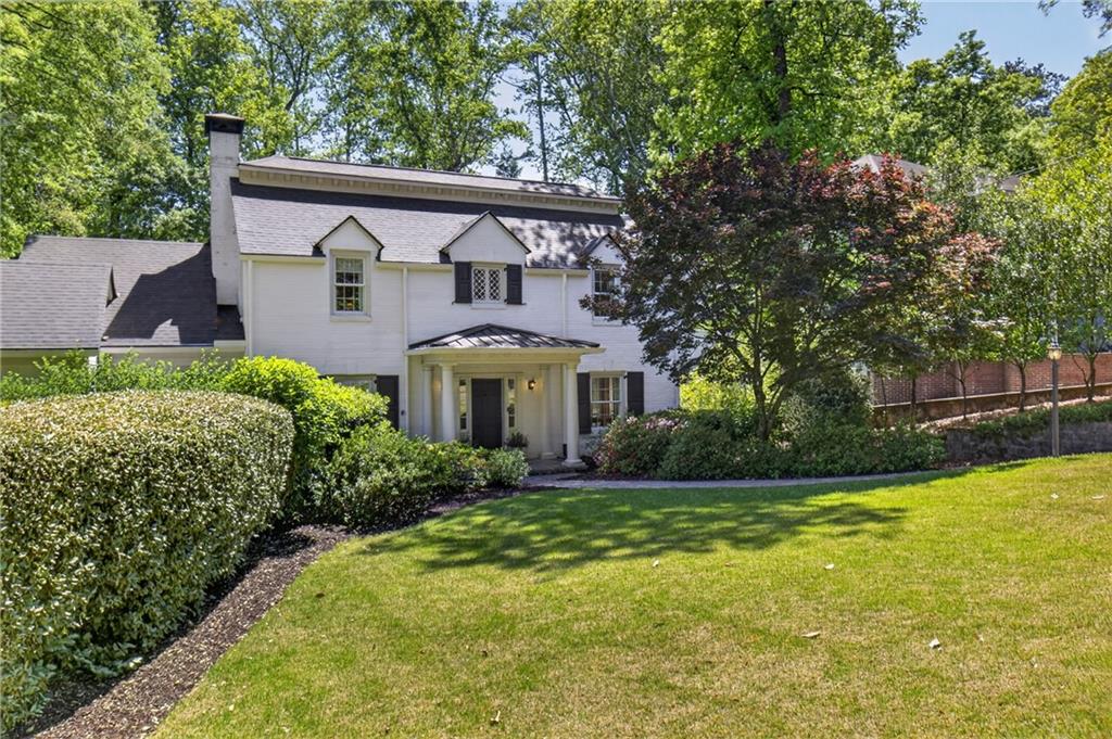 755 Greenview Avenue Northeast Atlanta, GA 30305 - Photo 2 of 28 a front view of a house with a yard and garage