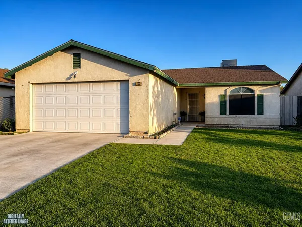 a front view of a house with yard