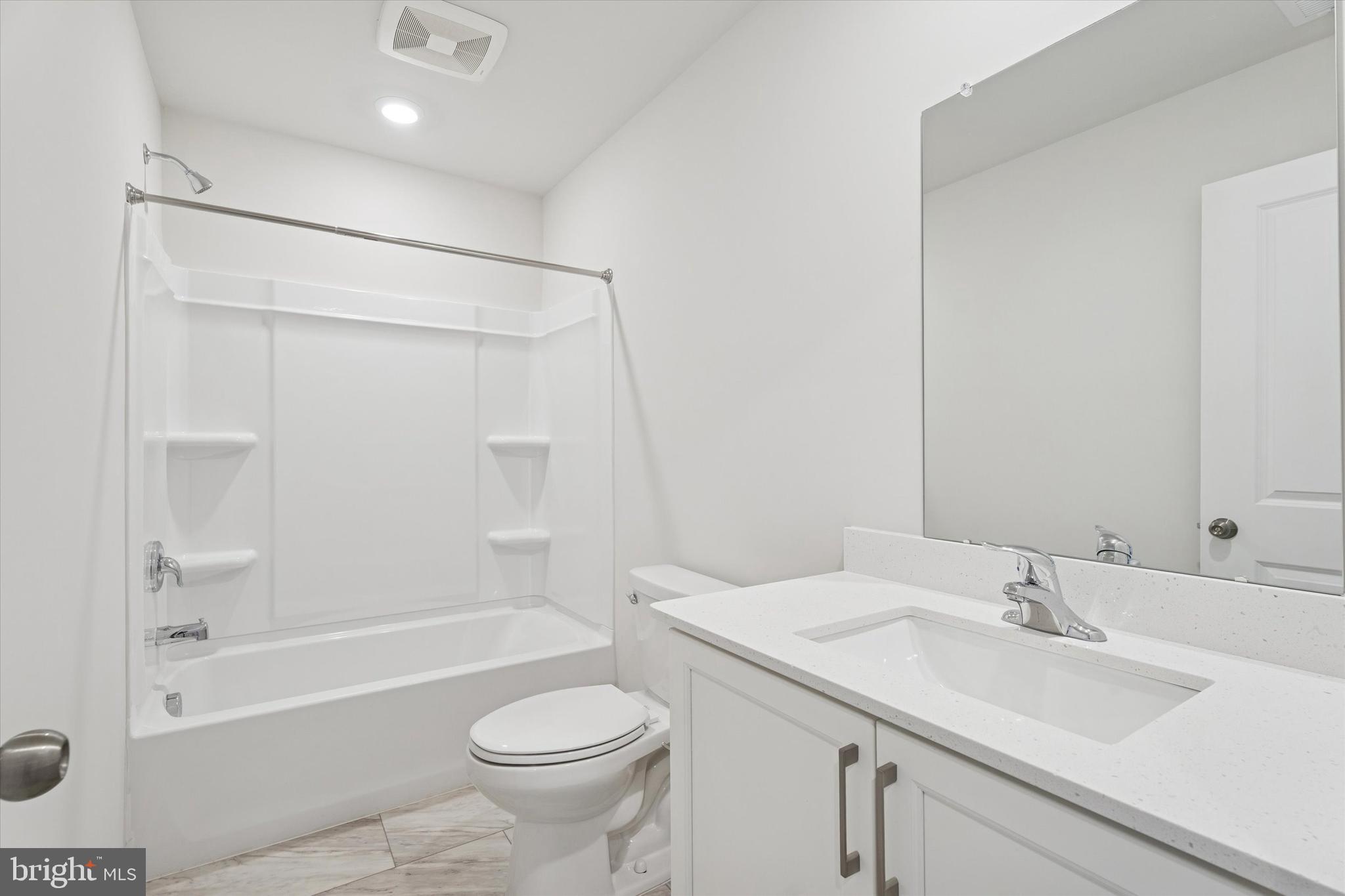 19 East Front Street Bridgeport, PA 19405 - Photo 15 of 25 a bathroom with a sink a toilet and a bathtub