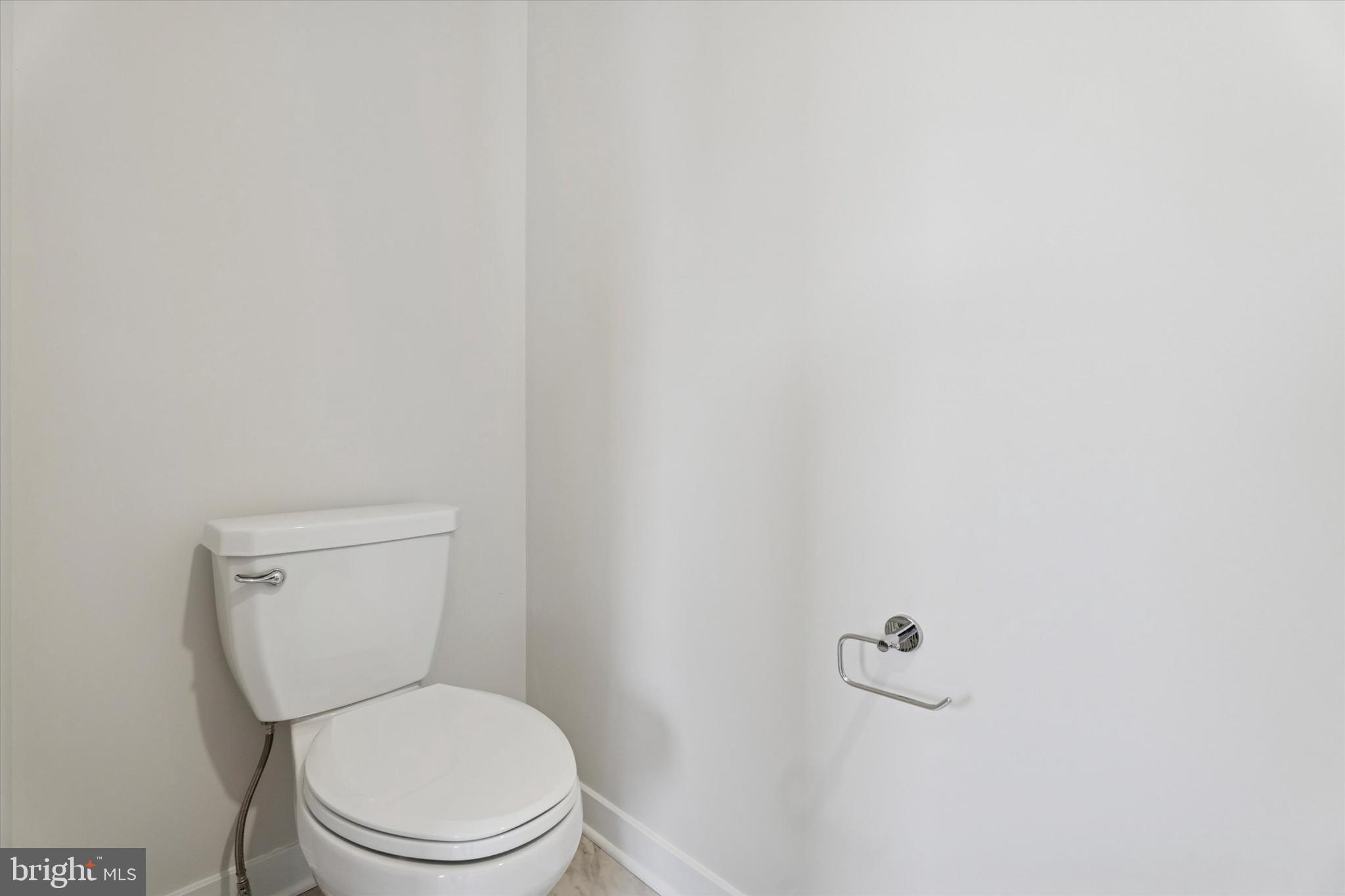 19 East Front Street Bridgeport, PA 19405 - Photo 24 of 25 a white toilet sitting next to a white wall