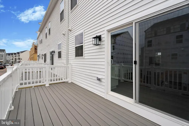 a view of a balcony with wooden floor