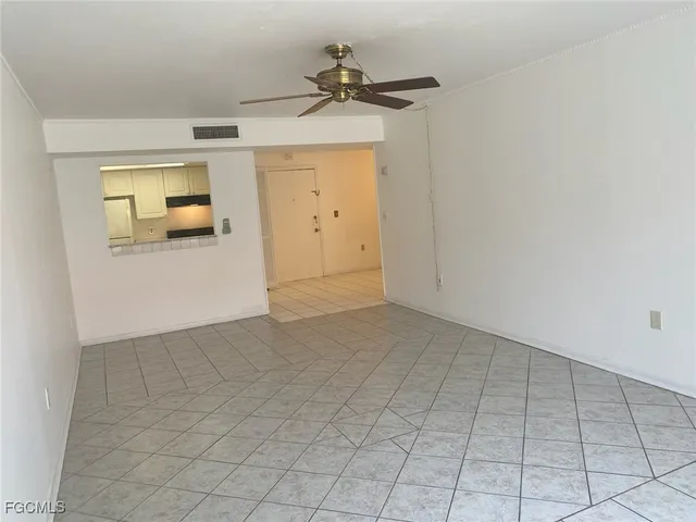 a kitchen with cabinets and appliances