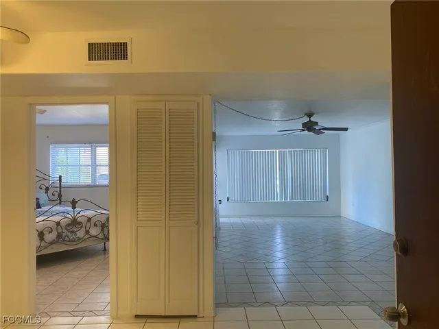 a view of a bedroom from the hallway