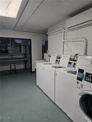 a view of a house with swimming pool and sitting area