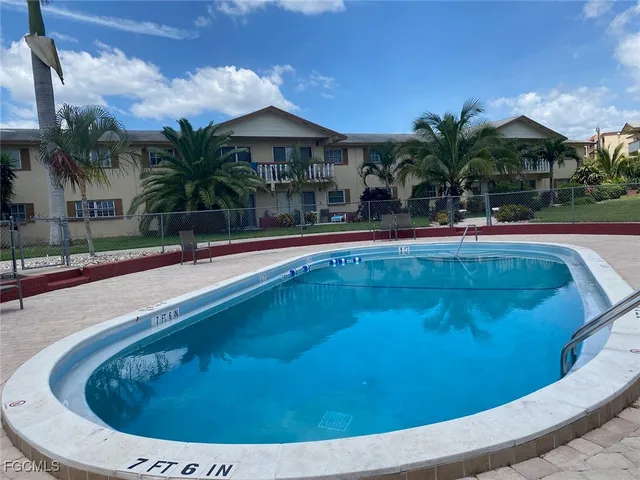 a view of swimming pool having outdoor seating