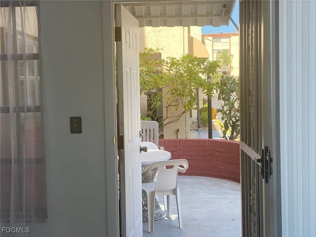 a view of a room that has a bed and a window