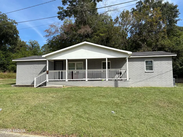 a house with trees in the background