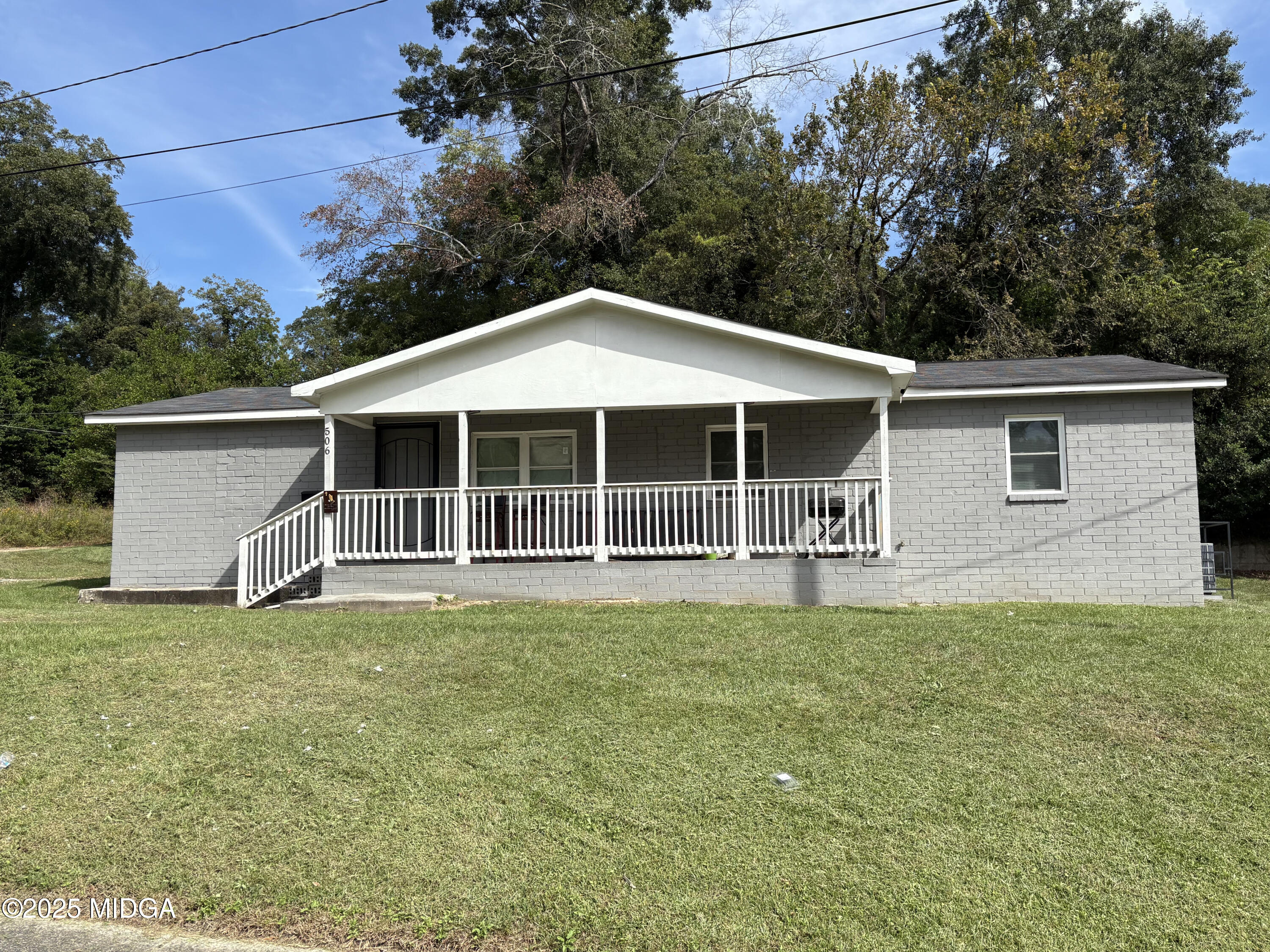 a house with trees in the background