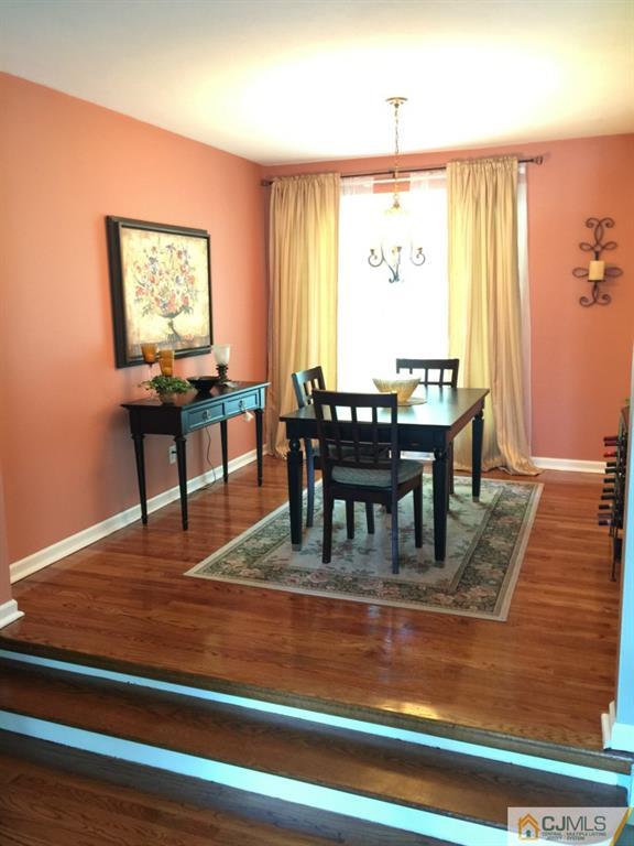 163 Normandy Road Colonia, NJ 07067 - Photo 3 of 14 a view of a dining room with furniture window and wooden floor
