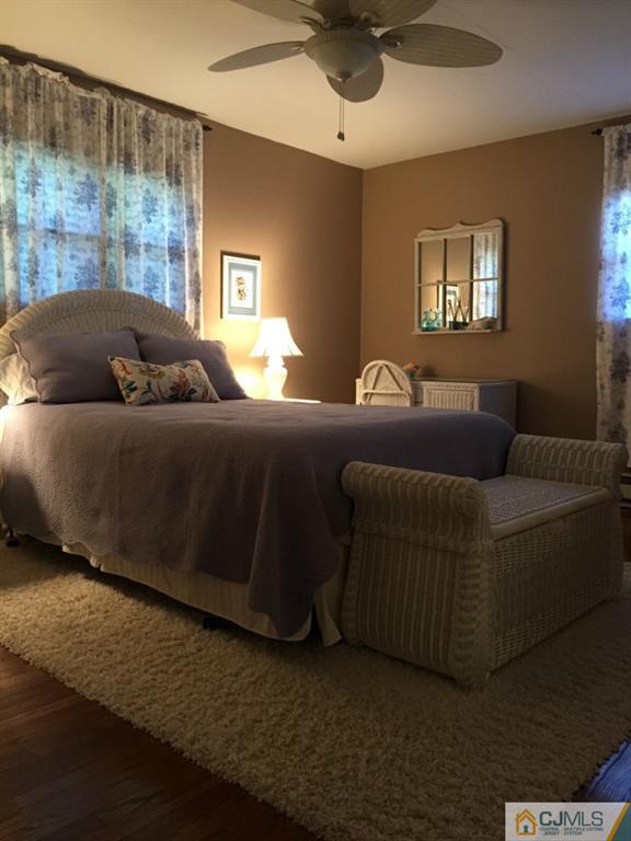 163 Normandy Road Colonia, NJ 07067 - Photo 7 of 14 a living room with a couch and a window