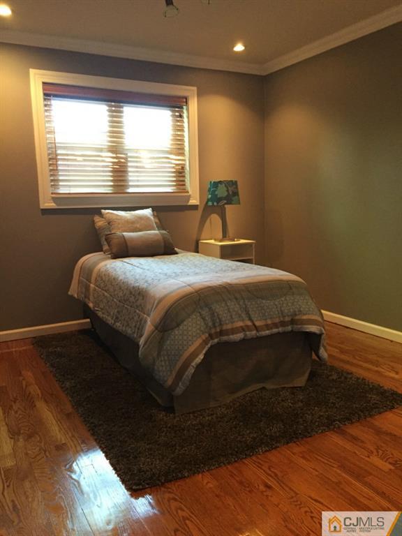 163 Normandy Road Colonia, NJ 07067 - Photo 9 of 14 a bedroom with a bed and window