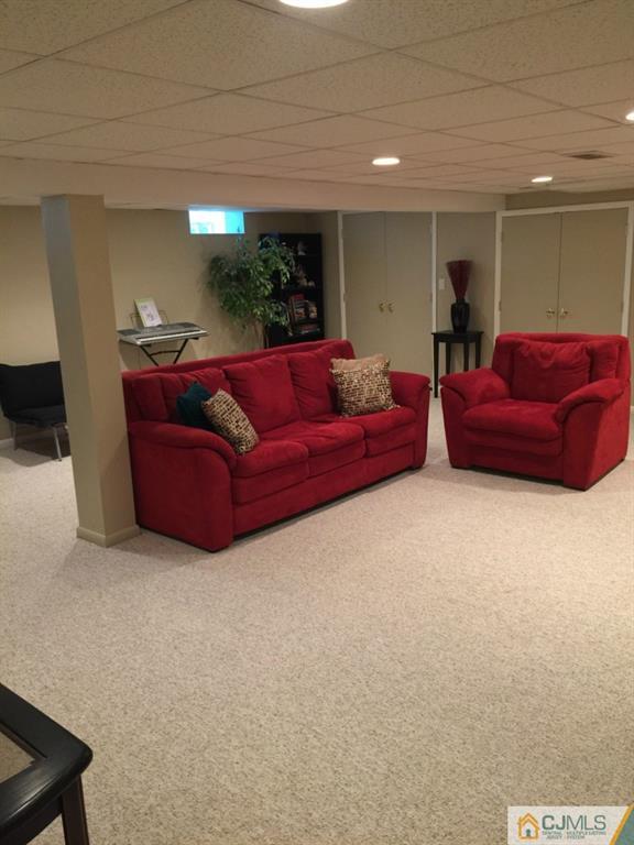 163 Normandy Road Colonia, NJ 07067 - Photo 10 of 14 a living room with furniture and a window