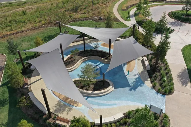 an aerial view of a house with outdoor space