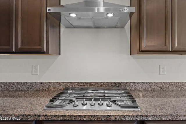 a view of a kitchen with a sink stainless steel appliances and cabinets