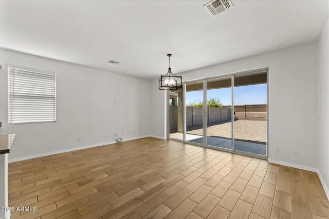a view of a dining room with furniture and window