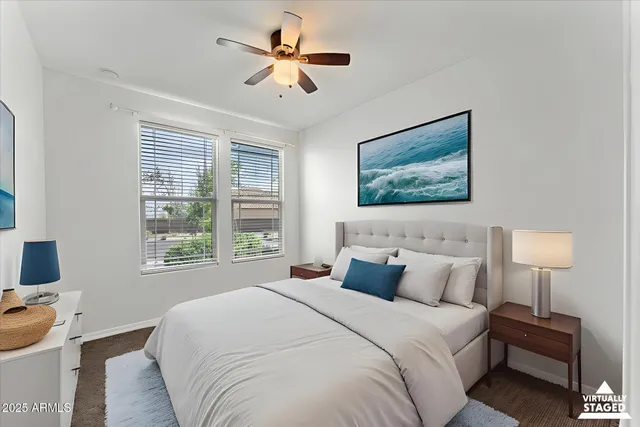 an empty room with chandelier fan