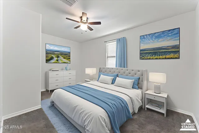 an empty room with closet and a ceiling fan