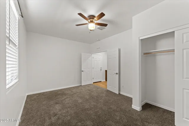 a bathroom with a sink a toilet a vanity and mirror