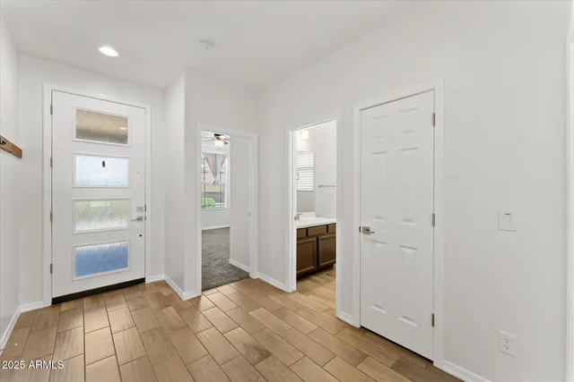 a kitchen with stainless steel appliances granite countertop a sink counter space cabinets and wooden floor