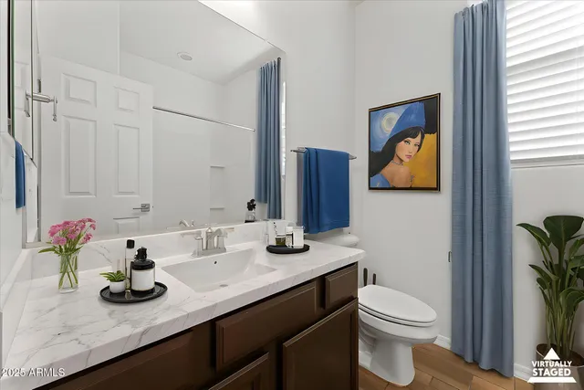 a view of bathroom with a potted plant