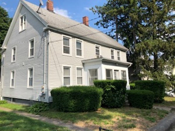 655-657 Hampden Street Holyoke, MA 01040 - Photo 1 of 3 a front view of a house with a garden