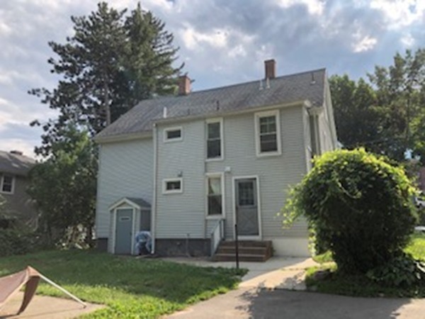 655-657 Hampden Street Holyoke, MA 01040 - Photo 2 of 3 a front view of a house with a yard
