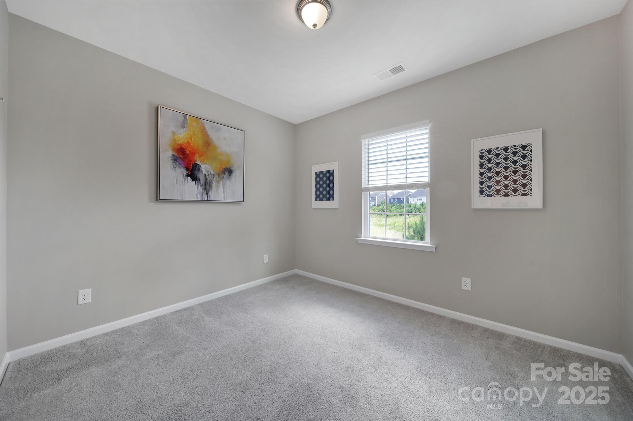 17237 Rider Wood Lane Charlotte, NC 28278 - Photo 16 of 43 a view of room with window and ceiling fan