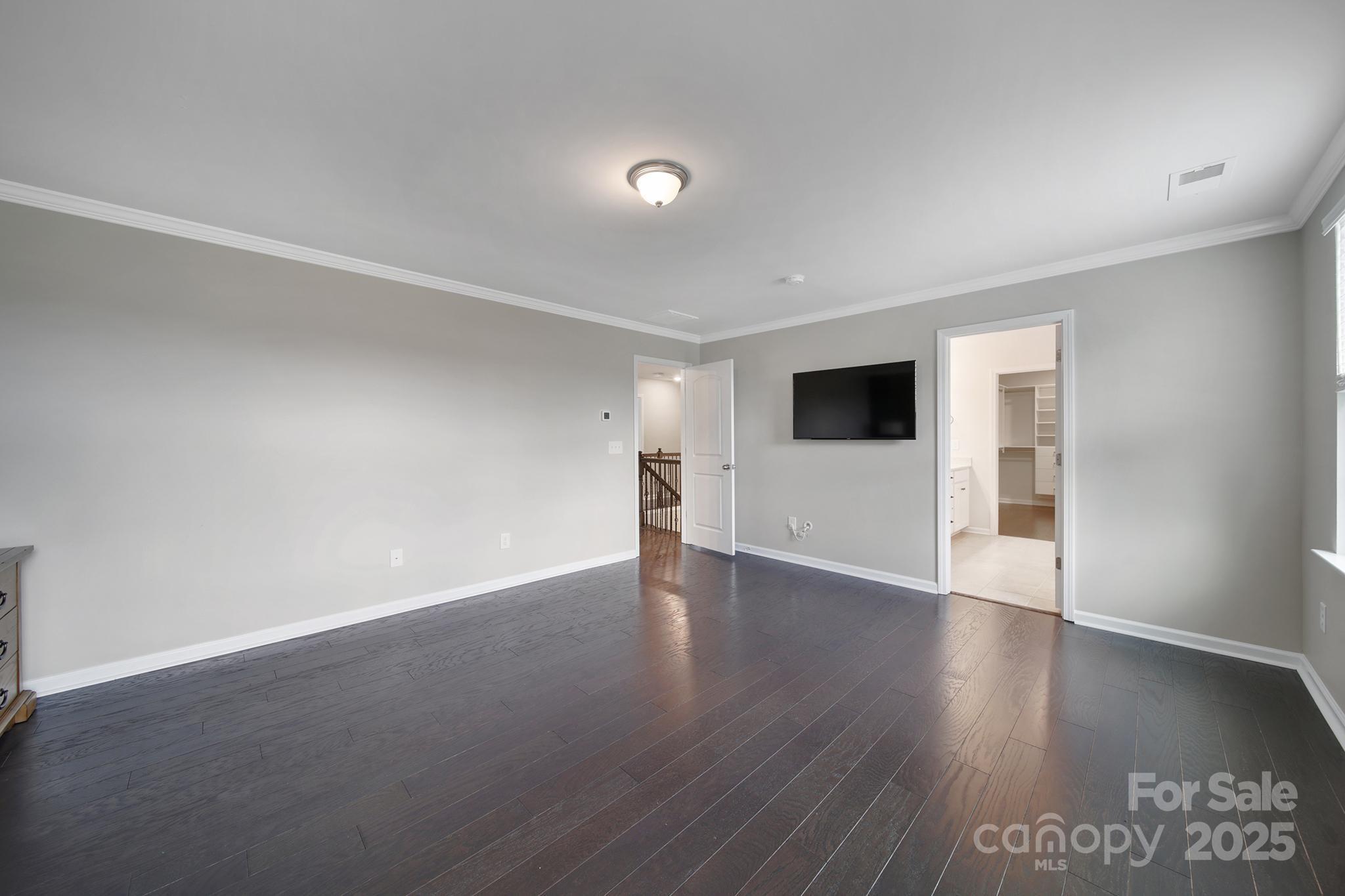 17237 Rider Wood Lane Charlotte, NC 28278 - Photo 20 of 43 a view of an empty room with wooden floor and a window