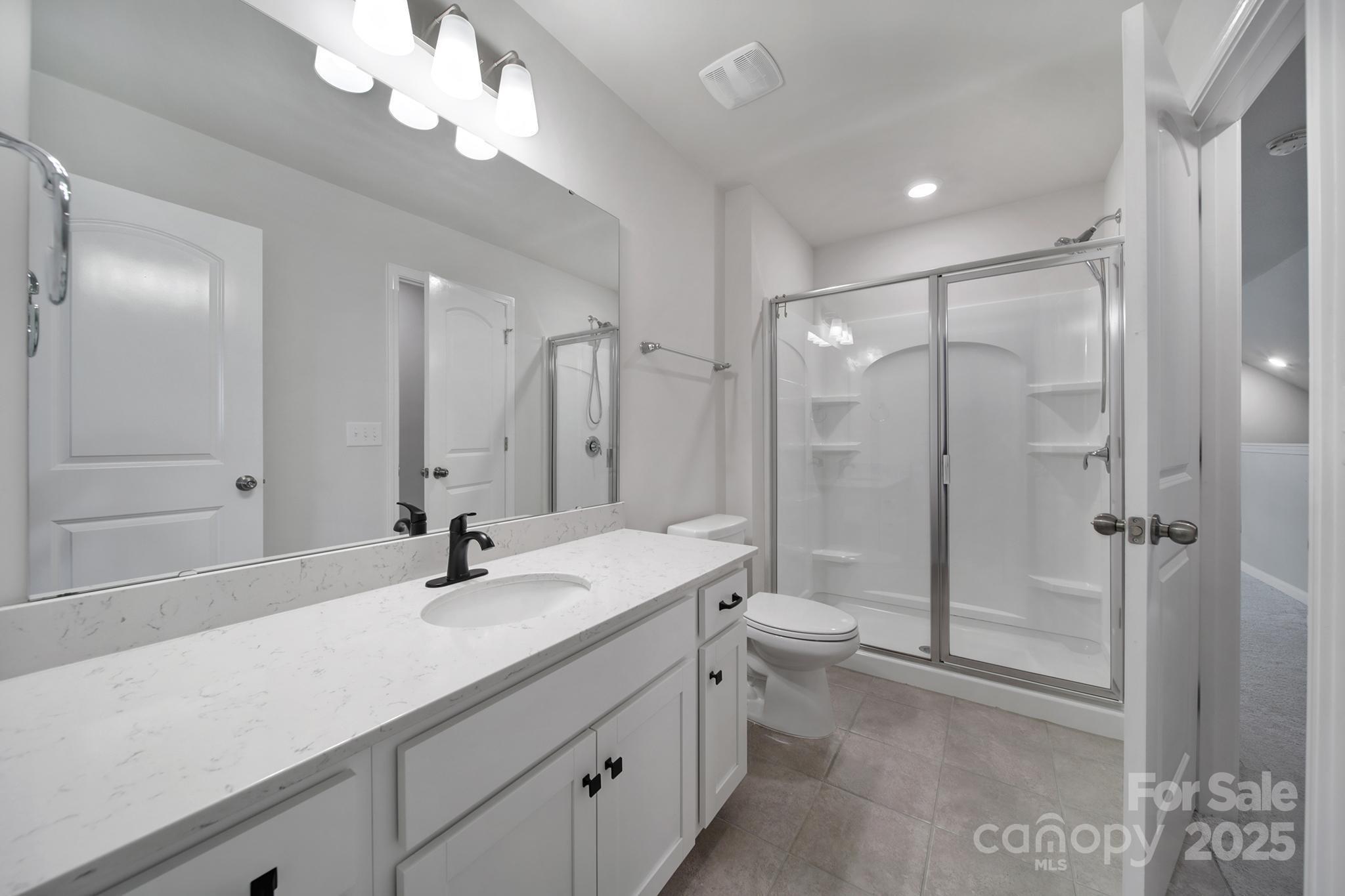 17237 Rider Wood Lane Charlotte, NC 28278 - Photo 25 of 43 a bathroom with a double vanity sink mirror double and shower