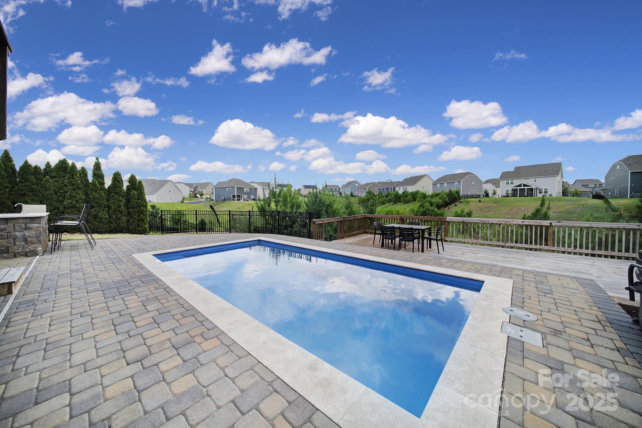 17237 Rider Wood Lane Charlotte, NC 28278 - Photo 38 of 43 a view of a swimming pool with a lounge chairs