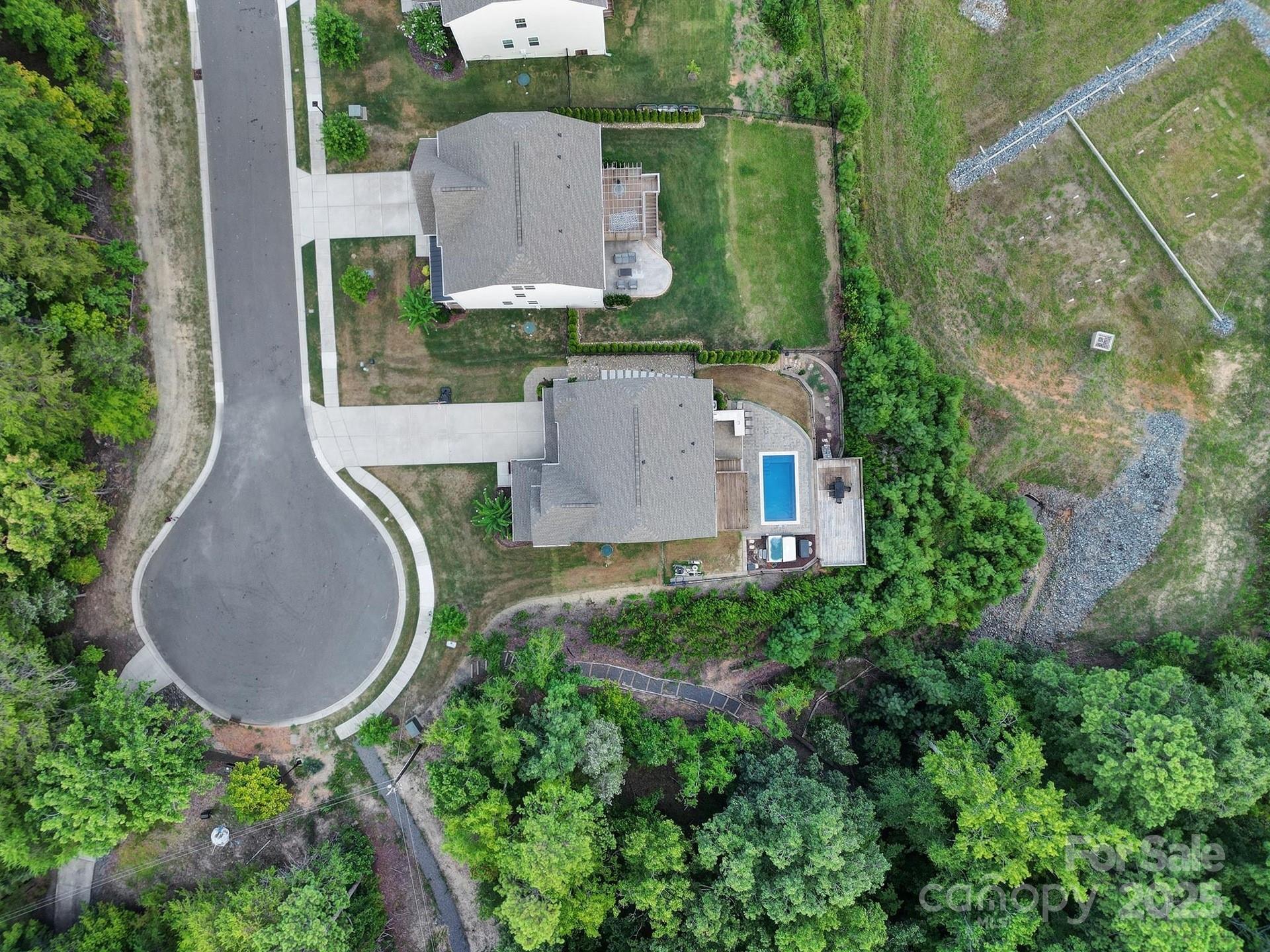17237 Rider Wood Lane Charlotte, NC 28278 - Photo 40 of 43 an aerial view of a house with garden space and street view