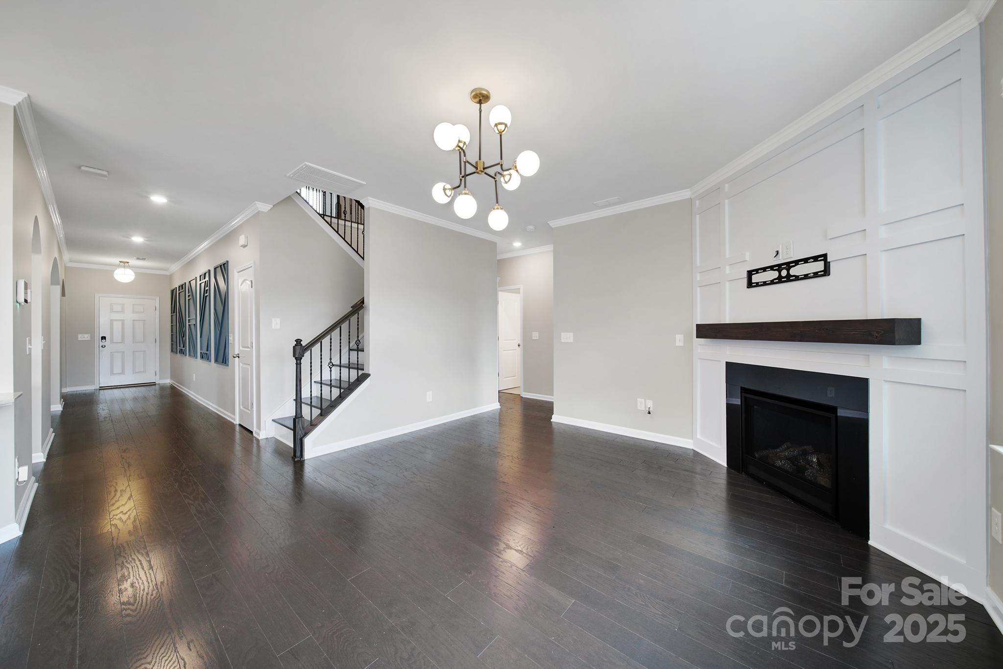 17237 Rider Wood Lane Charlotte, NC 28278 - Photo 9 of 43 a view of a livingroom with wooden floor a fireplace