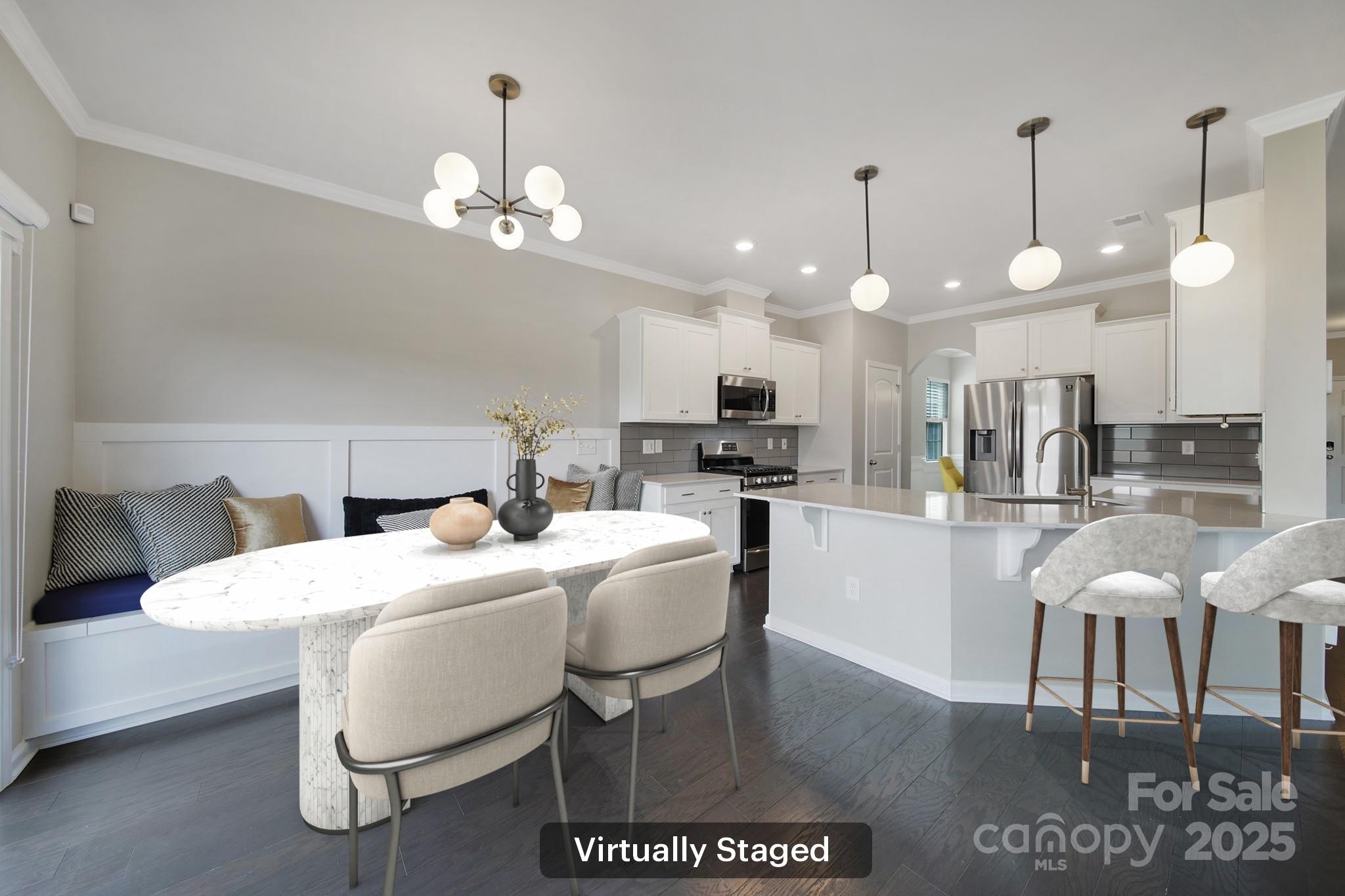 17237 Rider Wood Lane Charlotte, NC 28278 - Photo 10 of 43 a kitchen with a dining table chairs and a chandelier