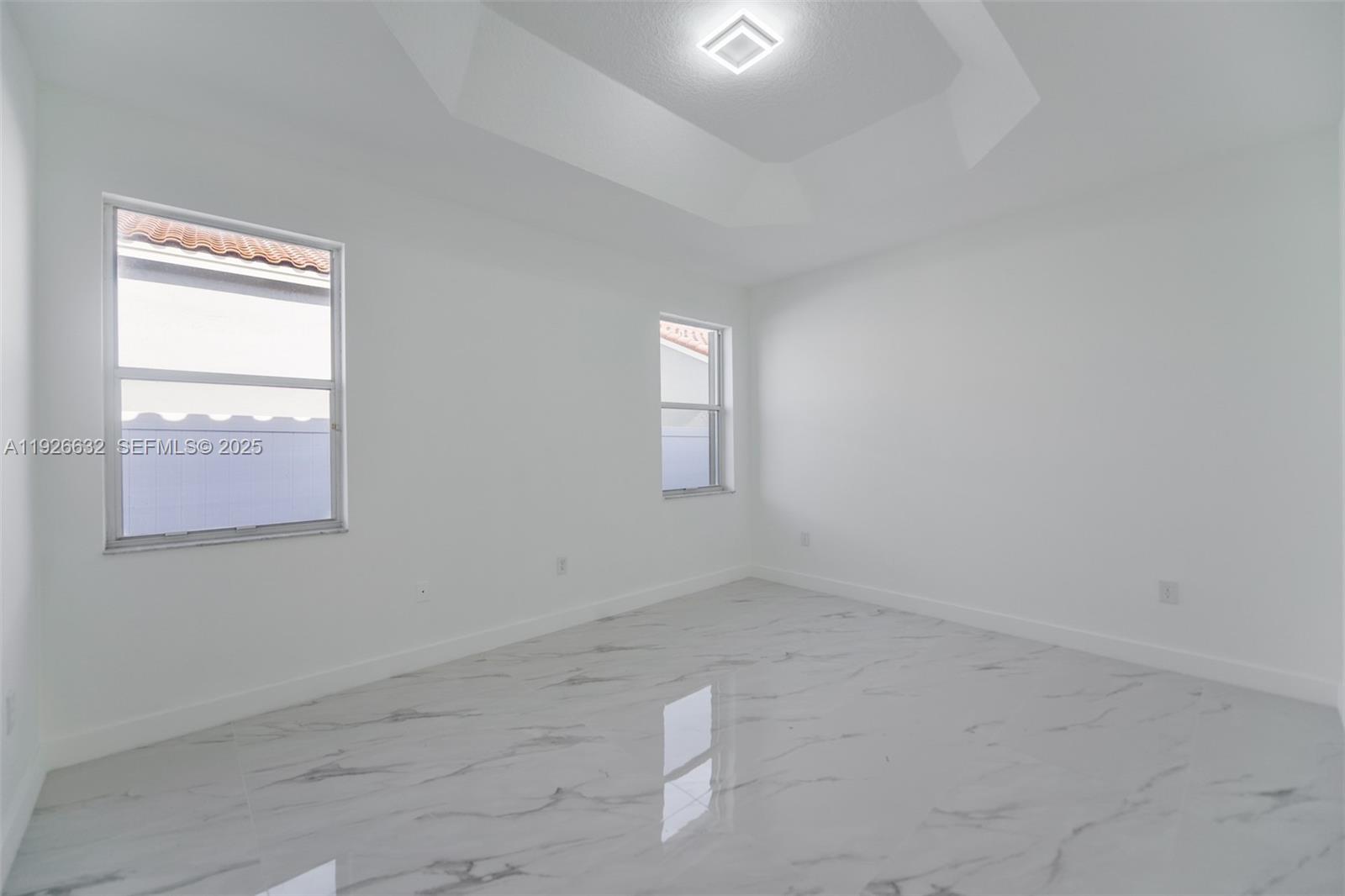 5290 Southwest 134th Avenue Miramar, FL 33027 - Photo 12 of 44 an empty room with a window