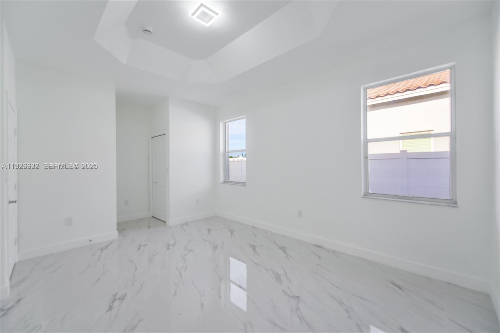 5290 Southwest 134th Avenue Miramar, FL 33027 - Photo 14 of 44 an empty room with windows