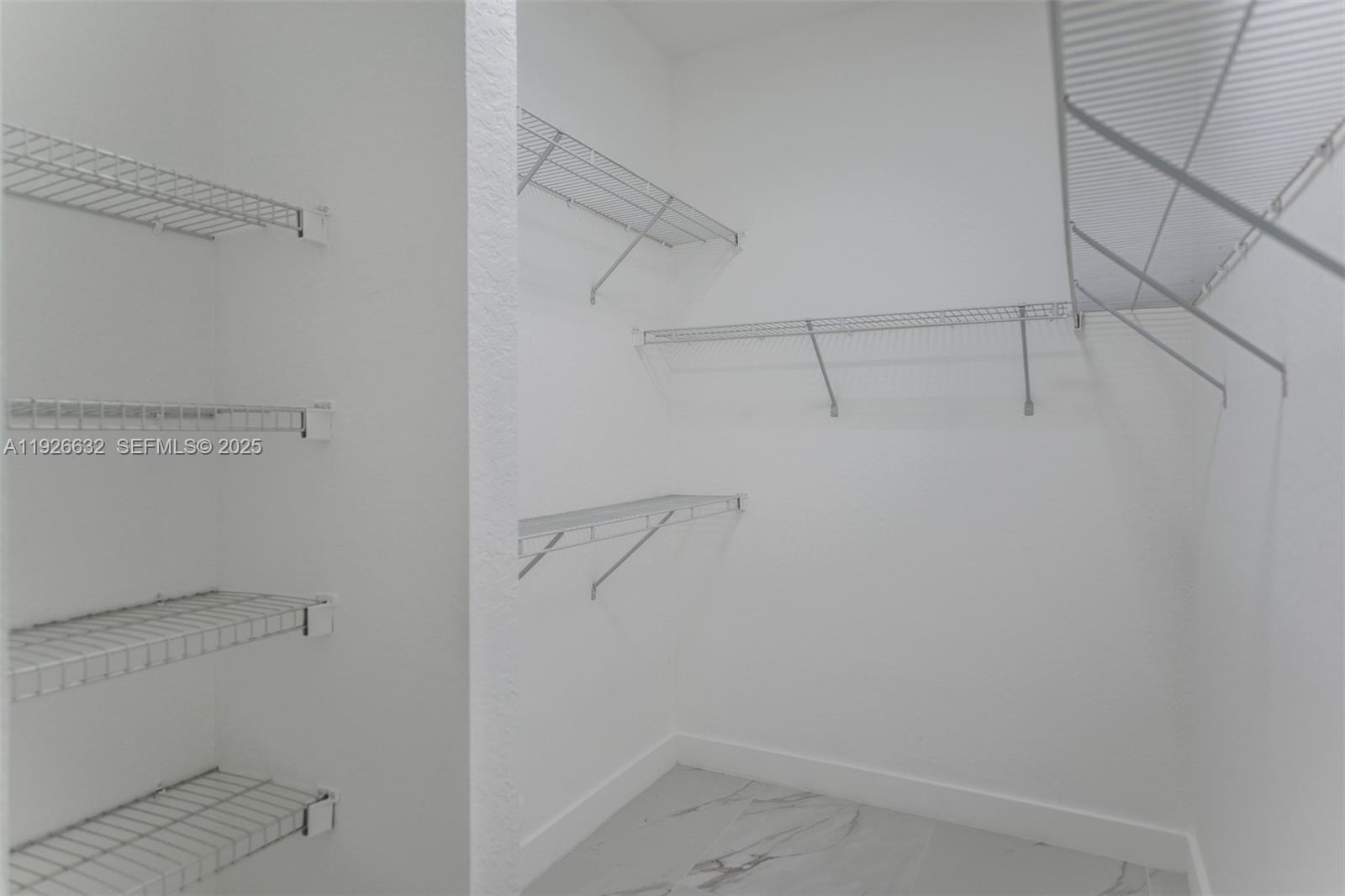 5290 Southwest 134th Avenue Miramar, FL 33027 - Photo 18 of 44 a view of a room with racks on the wall