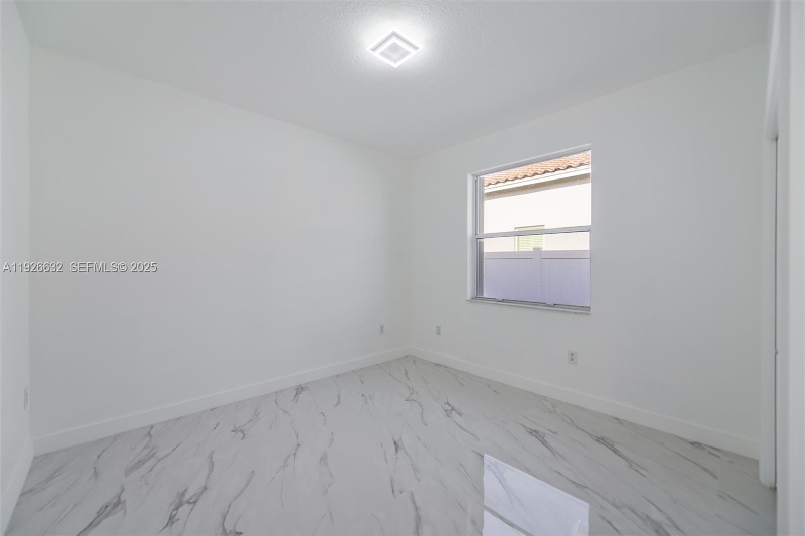 5290 Southwest 134th Avenue Miramar, FL 33027 - Photo 23 of 44 a view of empty room with window