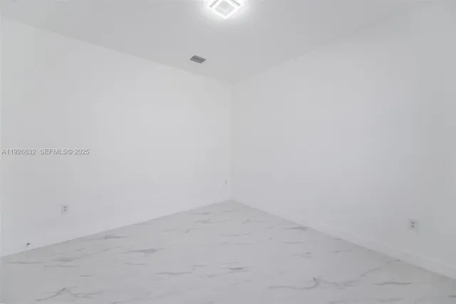 a utility room with closet dryer and washer