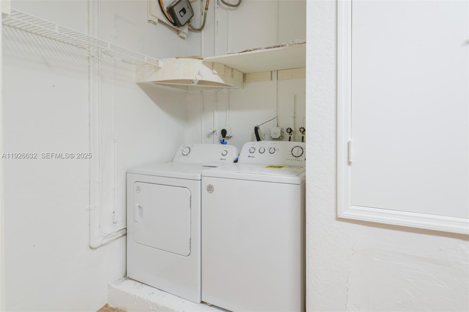 5290 Southwest 134th Avenue Miramar, FL 33027 - Photo 30 of 44 a utility room with closet dryer and washer