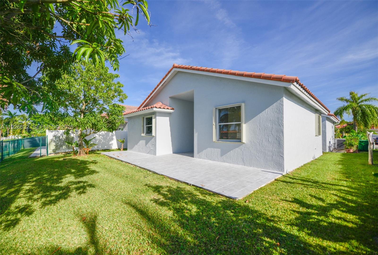 5290 Southwest 134th Avenue Miramar, FL 33027 - Photo 32 of 44 a view of a house with a yard