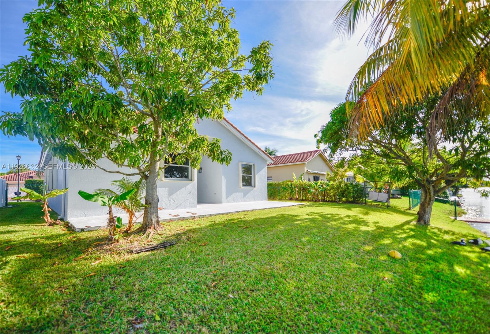 5290 Southwest 134th Avenue Miramar, FL 33027 - Photo 35 of 44 a house view with a garden space