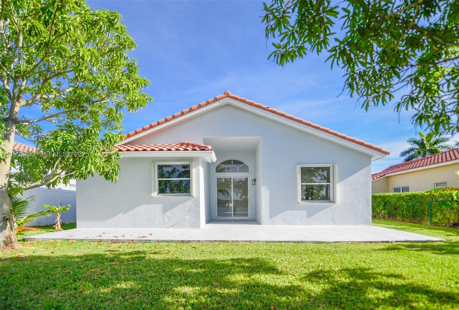 5290 Southwest 134th Avenue Miramar, FL 33027 - Photo 36 of 44 a front view of house with a garden