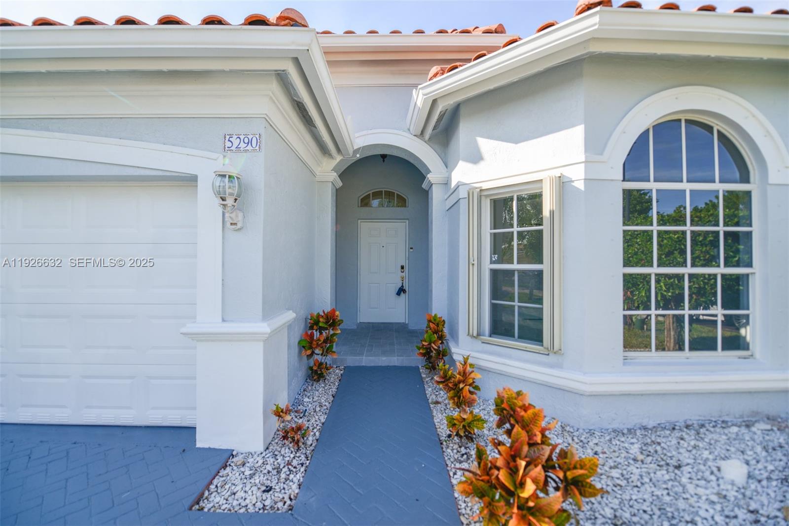 5290 Southwest 134th Avenue Miramar, FL 33027 - Photo 42 of 44 a front view of a house with lots of stuff