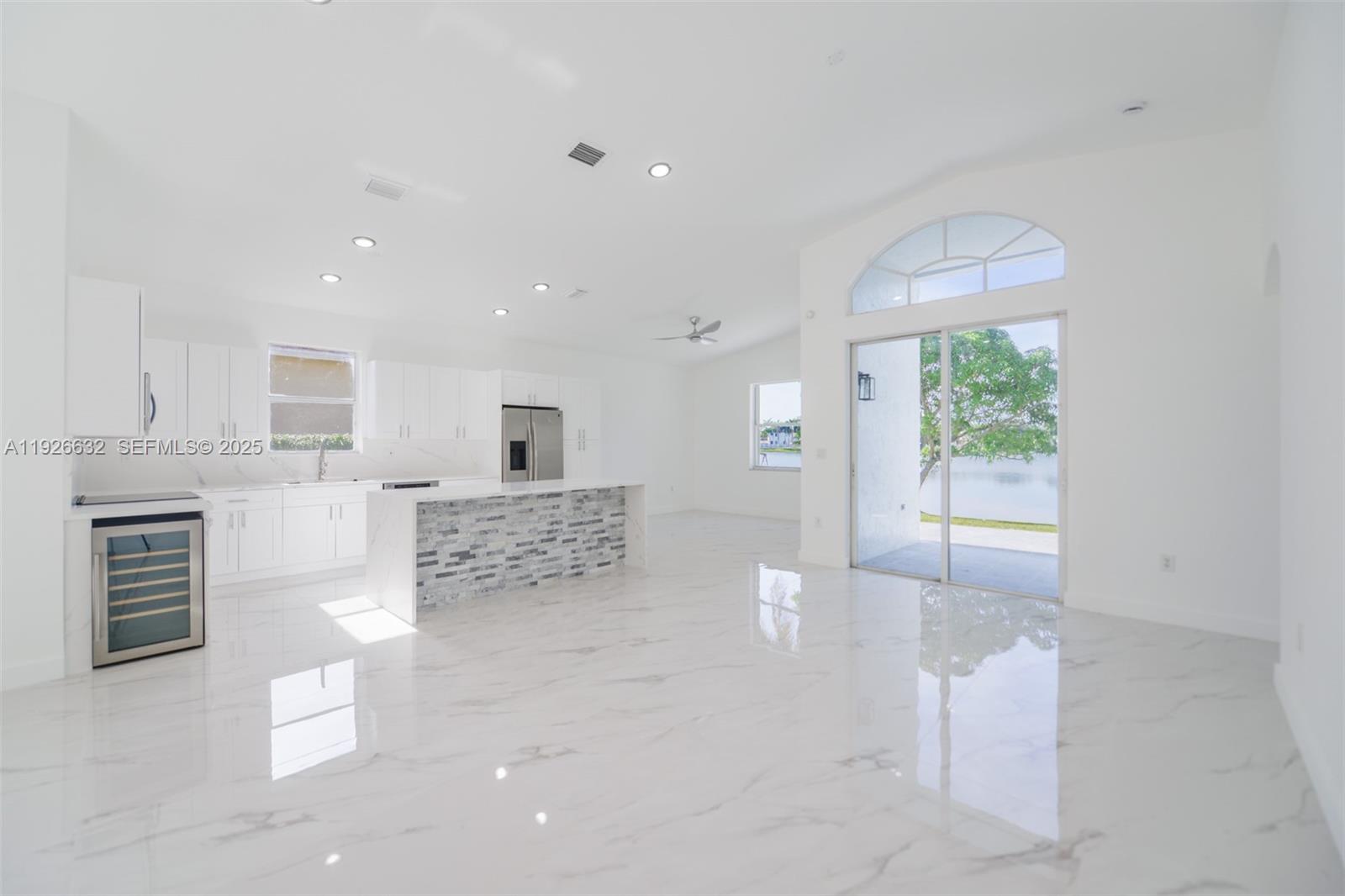 5290 Southwest 134th Avenue Miramar, FL 33027 - Photo 5 of 44 a living room with furniture and a fireplace
