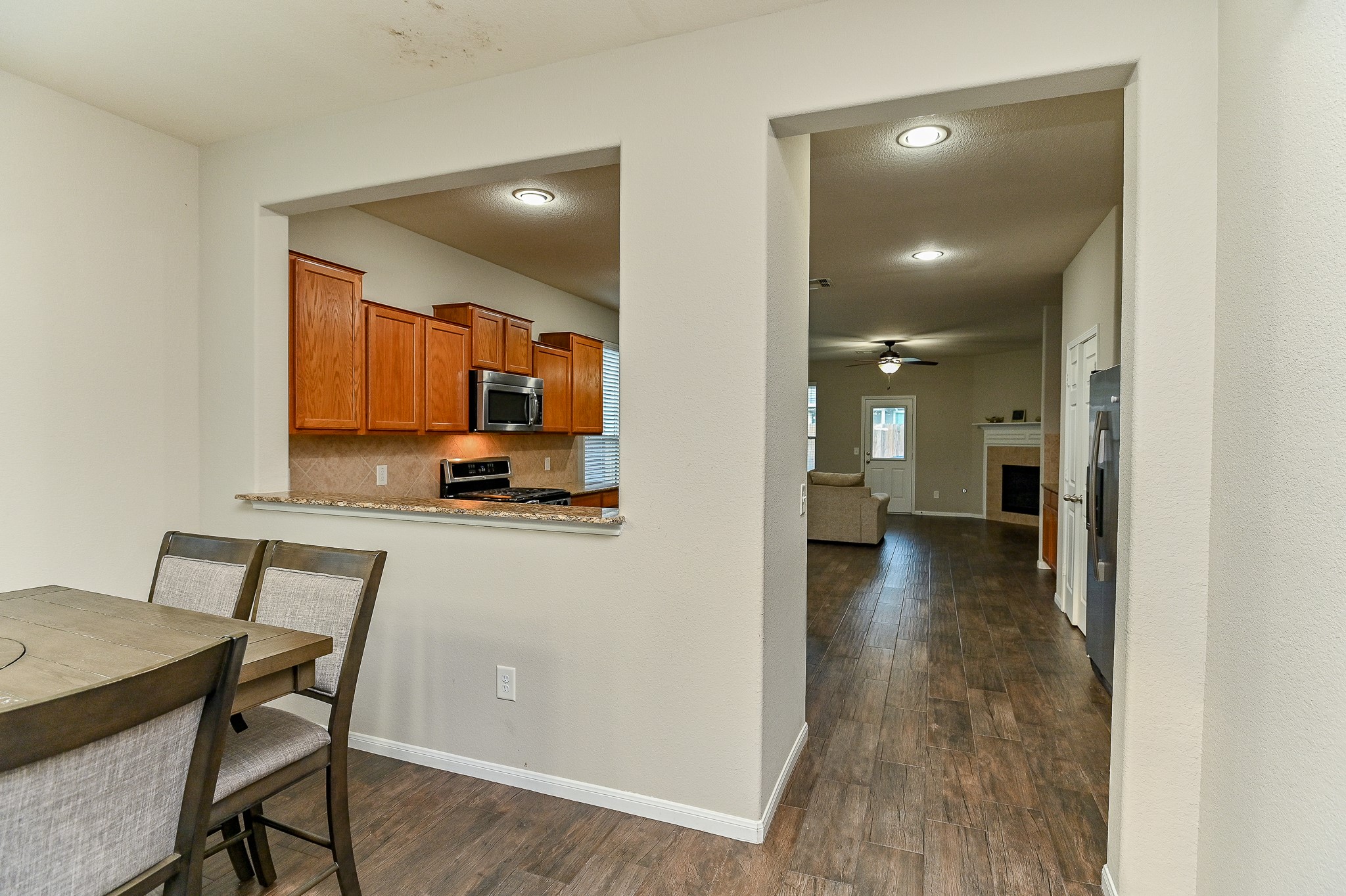 15406 Key Crest Lane Cypress, TX 77429 - Photo 12 of 47 a view of a hallway to a livingroom with furniture wooden floor and windows