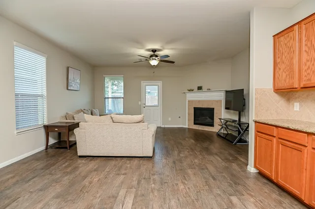a living room with furniture and a fireplace