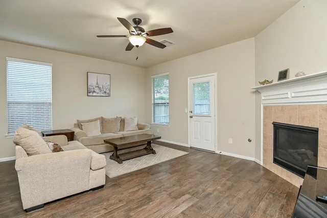 a living room with furniture and a fireplace