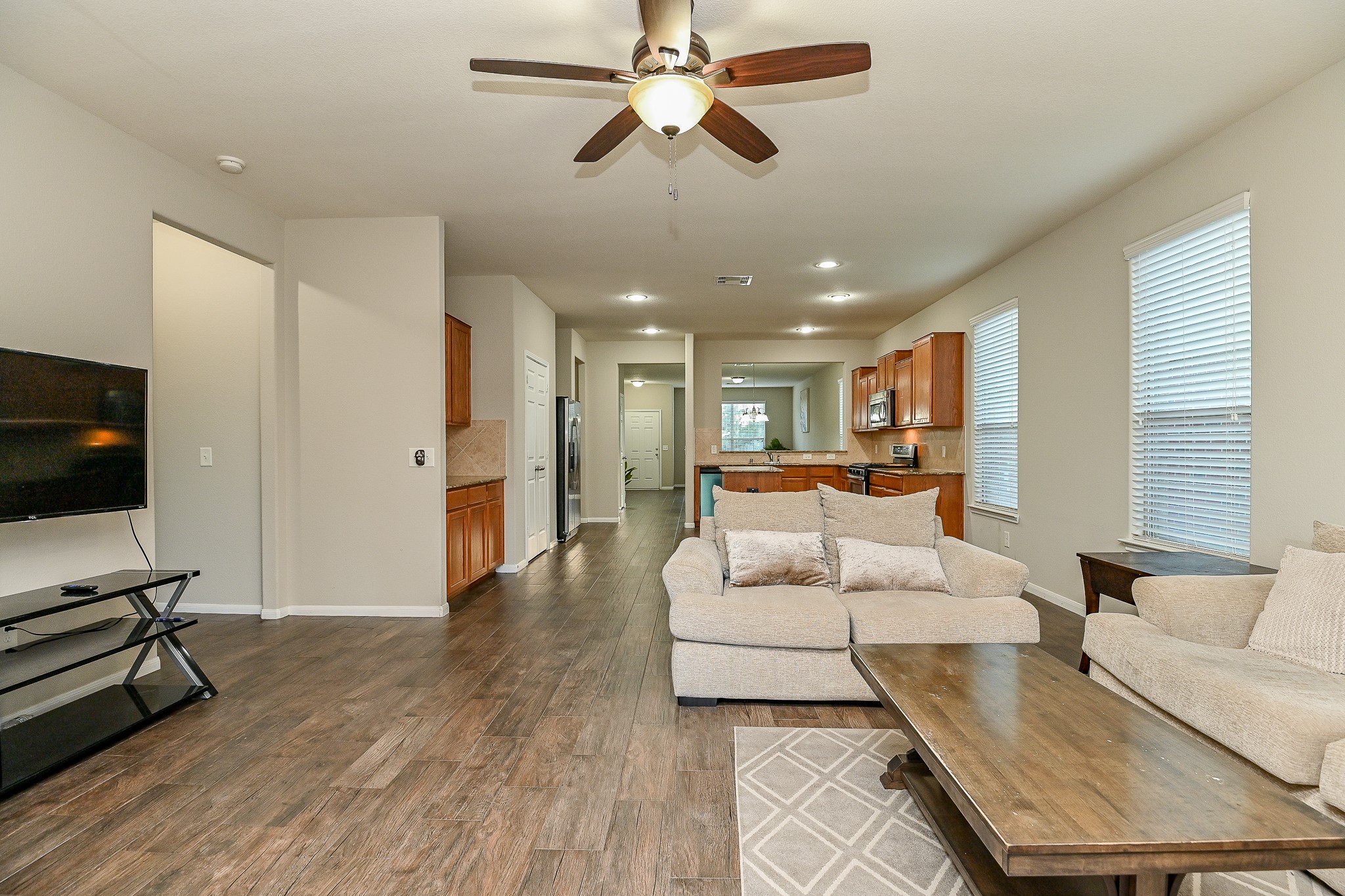 15406 Key Crest Lane Cypress, TX 77429 - Photo 23 of 47 a living room with furniture and a flat screen tv