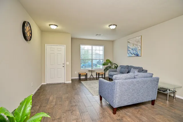 a living room with furniture and a large window